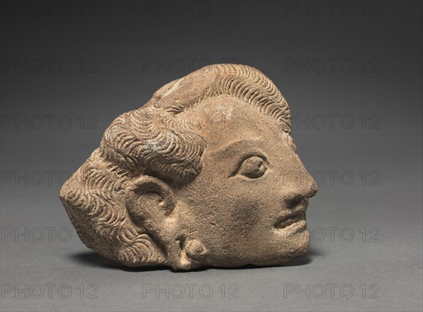 Yakshini's Head, c. 11th Century. Java, Eastern Javanese Period. Terracotta; overall: 10.1 x 11.4 cm (4 x 4 1/2 in.).