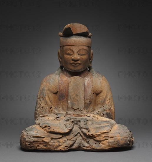 Shinto Deity, 900s. Japan, Heian period (794-1185). Wood, with traces of polychromy; overall: 50.3 x 38.1 cm (19 13/16 x 15 in.).