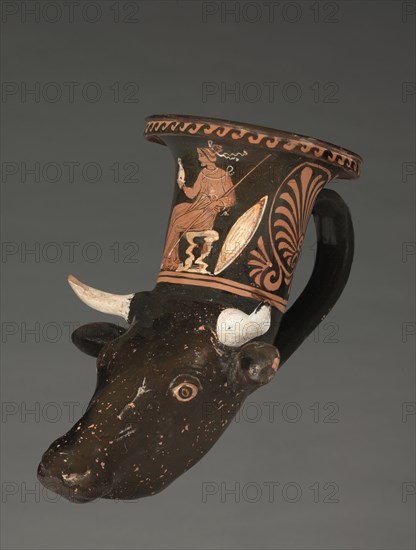 Apulian Cow-Head Rhyton, c. 340 BC. South Italy, Apulia, Tarentine, 4th Century BC. Molded earthenware with slip decoration; diameter: 10 cm (3 15/16 in.); overall: 17 cm (6 11/16 in.).