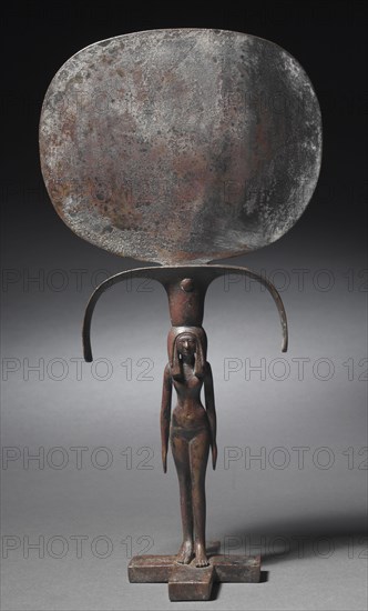 Caryatid Mirror, c. 1540-1296 BC. Egypt, New Kingdom, Dynasty 18. Bronze with black copper inlay?; overall: 38.9 x 20 cm (15 5/16 x 7 7/8 in.); figure: 16.7 x 4 cm (6 9/16 x 1 9/16 in.); disk: 16.6 cm (6 9/16 in.).