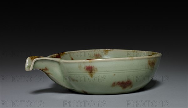 Spouted Bowl:  Longquan Ware, 14th Century. China, Zhejiang province, probably Lung-ch'uan kilns, Yuan dynasty (1271-1368). Celadon-glazed stoneware spotted with copper red; diameter: 17.5 cm (6 7/8 in.); overall: 5.6 x 21.5 cm (2 3/16 x 8 7/16 in.).