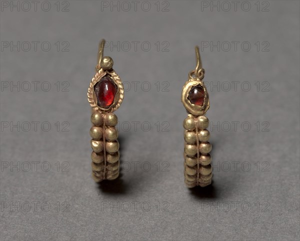Earrings, 100 BC-100. Syria, Roman, 1st Century BC-1st Century. Gold and garnet; diameter: 2.4 cm (15/16 in.); overall: 0.5 cm (3/16 in.).