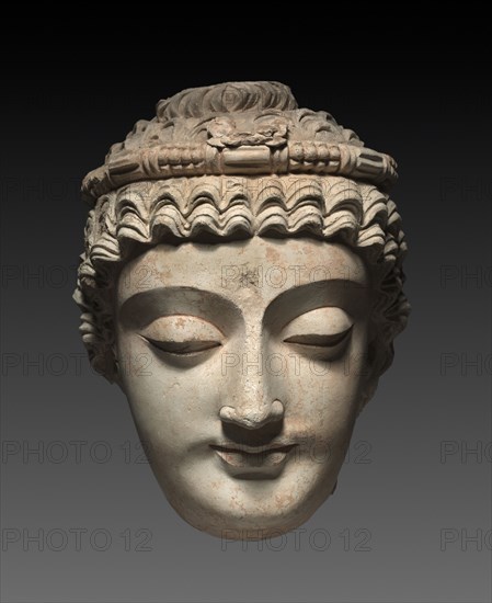Head of Bodhisattva Avalokiteshvara, 300s-400s. Afghanistan or Pakistan, Gandhara, late Kushan Period (1st century-320). Stucco with traces of paint; overall: 45.7 x 35.5 cm (18 x 14 in.).