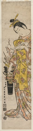 Courtesan Reading a Poem Slip Tied to Flowers in a Vase, mid-1740s. Ishikawa Toyonobu (Japanese, 1711-1785). Color woodblock print; overall: 69.5 x 16.5 cm (27 3/8 x 6 1/2 in.).