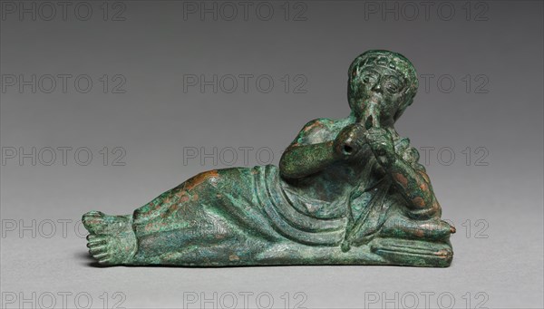 Vessel Ornament of Reclining Flutist, probably 400-375 BC. Italy, Etruscan, early 4th Century BC. Bronze; overall: 5.1 cm (2 in.).