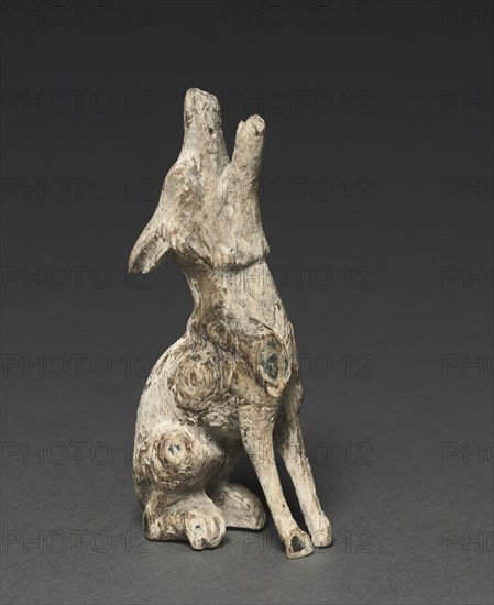 Howling Wolf, c. 500-200 BC. Southern Siberia, 5th-3rd Century BC. Wood with shell inlays; overall: 11.1 x 3.3 x 5.9 cm (4 3/8 x 1 5/16 x 2 5/16 in.).