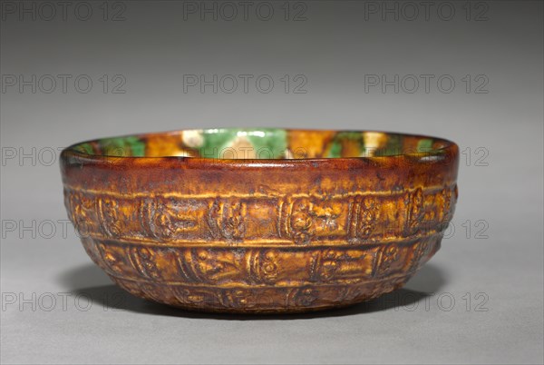 Bowl with Bands and Spirals in Relief, late 7th-early 8th Century. China, Tang dynasty (618-907). Glazed earthenware with molded decoration; diameter: 10.1 cm (4 in.); overall: 3.9 cm (1 9/16 in.).