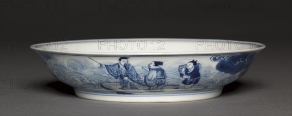 Dish with Laozi Riding a Water Buffalo (interior); Pavilion and Immortals in Rocky Landscape (exterior), 1723-1735. China, Jiangxi province, Jingdezhen kilns, Qing dynasty (1644-1912), Yongzheng reign (1722-1735). Porcelain with underglaze blue decoration; diameter: 19.9 cm (7 13/16 in.); overall: 7.2 cm (2 13/16 in.).