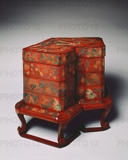 Tiered Food Box with Stand, late 18th Century. Japan, Okinawa Prefecture, Ryukyu Islands, Edo Period (1615-1868). Red lacquer over a wood core, with litharge painting and engraved gold designs; overall: 53 x 68 cm (20 7/8 x 26 3/4 in.)