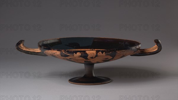 Faliscan Kylix, c. 350 BC. Italy, Faliscan, Etruscan, 4th Century BC. Earthenware with slip decoration; diameter: 22.6 cm (8 7/8 in.); overall: 9.5 x 31.8 cm (3 3/4 x 12 1/2 in.); diameter of foot: 9.6 cm (3 3/4 in.).