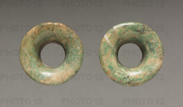 Pair of Ear Ornaments, 150-200. Central Mexico, Teotihuacán style, Classic Period. Jadeite-albitite(?); diameter: 5.6 cm (2 3/16 in.); overall: 2.4 cm (15/16 in.).