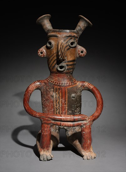 Seated Male Figure, c. 200. Mexico, Jalisco, Zacatecas Style. Earthenware with colored slips; overall: 40.6 x 23.1 x 19.5 cm (16 x 9 1/8 x 7 11/16 in.).