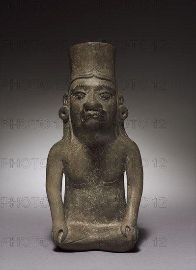 Urn Figure, c. 150 BC-AD 200. Mexico, Oaxaca, Zapotec. Earthenware; overall: 29.8 x 14.4 x 13 cm (11 3/4 x 5 11/16 x 5 1/8 in.).