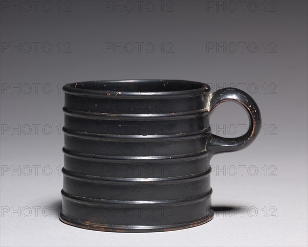 Mug, Late 5th-4th century BC. South Italy, Late 5th-4th Century BC. Black-glazed earthenware; diameter: 7.6 cm (3 in.); overall: 6.9 cm (2 11/16 in.); diameter of foot: 8 cm (3 1/8 in.).
