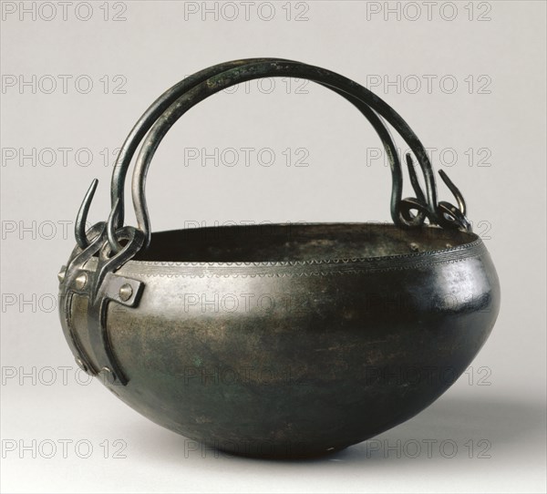 Ritual Cauldron, c. 1000-900 BC. Hungary, Bronze Age, c. 2500-800 BC. Bronze, hammered, cast and wrought ; diameter: 29.9 cm (11 3/4 in.); overall: 16.5 x 30.2 cm (6 1/2 x 11 7/8 in.).