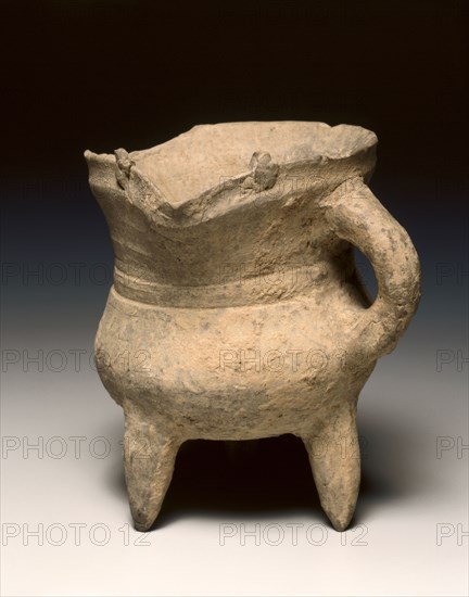 Wine Warmer (Jue), c. 1300-1023 BC. China, Shang dynasty (c.1600-c.1046 BC), Anyang phase (c.1250-1046 BC). Pottery, tripod vessel with loop handle and rudimentary bowstring decoration; diameter: 11.5 cm (4 1/2 in.); overall: 13.3 cm (5 1/4 in.).
