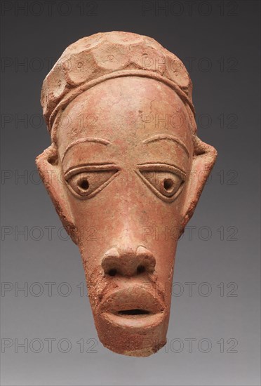 Head, 600 BC-AD 250. Guinea Coast, Nigeria, Nok region, 7th century BC-3rd century AD. Terracotta; overall: 38.2 x 20 cm (15 1/16 x 7 7/8 in.)