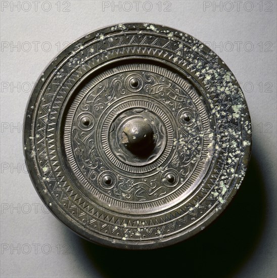 Mirror with Concentric Circles, an Immortal, and Auspicious Animals, 1st century BC-1st century AD. China, Western Han dynasty (202 BC-AD 9). Bronze; diameter: 13.8 cm (5 7/16 in.); overall: 1 cm (3/8 in.); rim: 0.5 cm (3/16 in.).