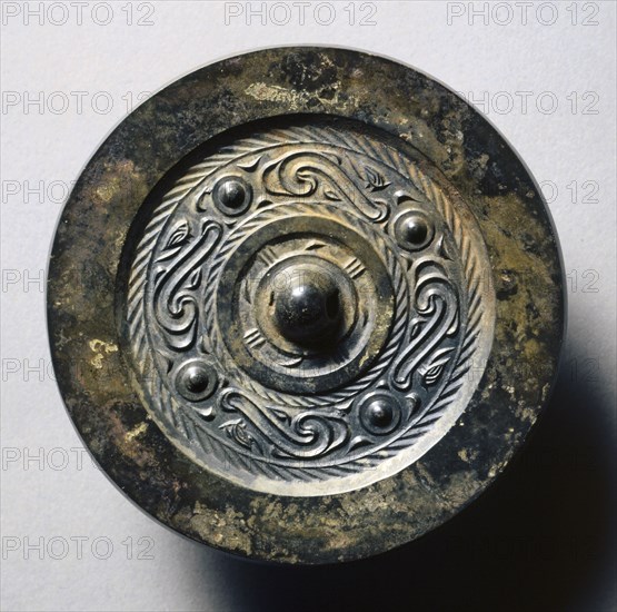 Mirror with Four Nipples, Quasi- Dragons, and Birds, 1st century BC. China, Western Han dynasty (202 BC-AD 9). Bronze; diameter: 9.9 cm (3 7/8 in.); overall: 0.9 cm (3/8 in.); rim: 0.4 cm (3/16 in.).