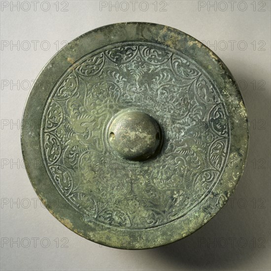 Mirror with Quatrefoil, Paired Phoenixes, and Auspicious Animals, early 3rd -early 4th century. China, Three Kingdoms (221-280) - Western Jin dynasty (265-316). Bronze; diameter: 18.6 cm (7 5/16 in.); overall: 1.2 cm (1/2 in.); rim: 0.4 cm (3/16 in.).
