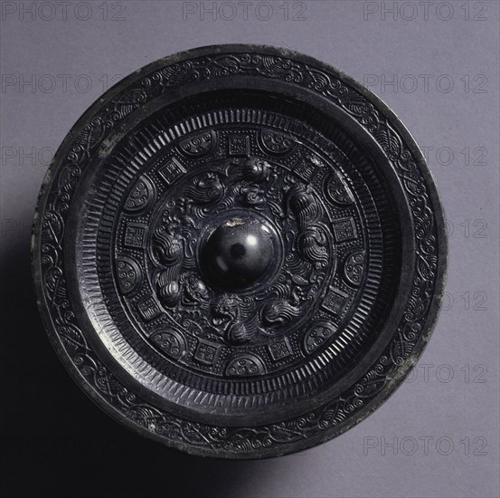Mirror with Auspicious Animals Surrounded by Rings of Squares and Semicircles, late 2nd century. China, Eastern Han dynasty (25-220). Bronze; diameter: 11.8 cm (4 5/8 in.); overall: 0.8 cm (5/16 in.); rim: 0.4 cm (3/16 in.).