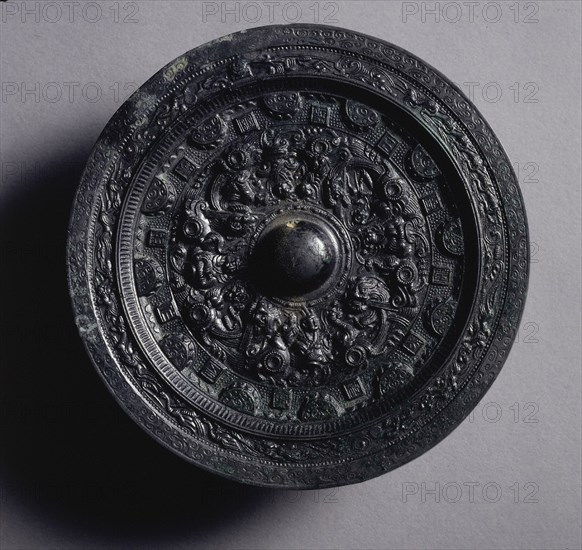 Mirror with Deities and Animals Surrounded by Rings of Squares and Semicircles, late 2nd-early 3rd century. China, Eastern Han dynasty (25-220). Bronze; diameter: 11.8 cm (4 5/8 in.); overall: 1.2 cm (1/2 in.); rim: 0.4 cm (3/16 in.).