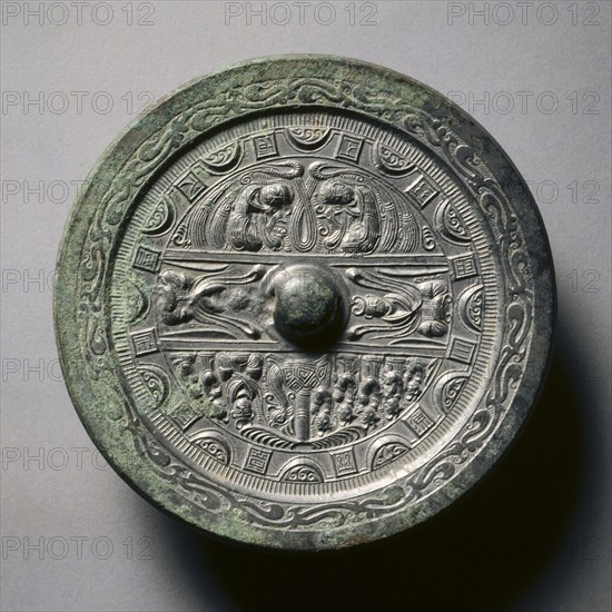 Mirror Featuring Deities and Kings in Three Sections Surrounded by Rings of Squares and Semicircles, late 2nd-early 3rd century. China, Eastern Han dynasty (25-220). Bronze; diameter: 13.9 cm (5 1/2 in.); overall: 1 cm (3/8 in.); rim: 0.4 cm (3/16 in.).