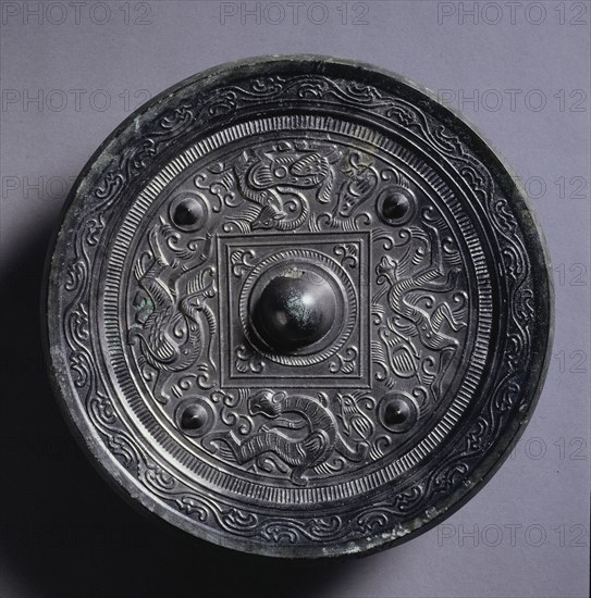 Mirror with a Central Square, an Immortal, and Auspicious Animals, 2nd century. China, Eastern Han dynasty (25-220). Bronze; diameter: 18.5 cm (7 5/16 in.); overall: 1.7 cm (11/16 in.); rim: 0.8 cm (5/16 in.).