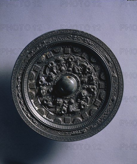 Mirror with Deities and Animals Surrounded by Rings of Squares and Semicircles, late 2nd century. China, Eastern Han dynasty (25-220). Bronze; diameter: 15 cm (5 7/8 in.); overall: 1.3 cm (1/2 in.); rim: 0.5 cm (3/16 in.).