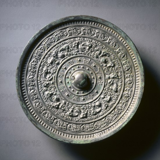 Mirror with Deities and Animals in Concentric Circles, late 6th-early 7th century. China, Sui dynasty (581-618). Bronze; diameter: 33.4 cm (13 1/8 in.); overall: 1.6 cm (5/8 in.); rim: 0.9 cm (3/8 in.).