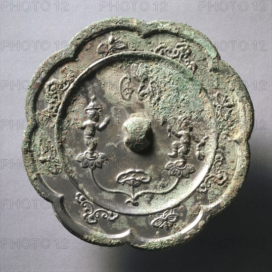 Lobed Mirror with Acrobats on Lotus Blossoms, early 7th Century - early 10th Century. China, Tang dynasty (618-907). Bronze; diameter: 14.1 cm (5 9/16 in.); overall: 0.8 cm (5/16 in.); rim: 0.6 cm (1/4 in.).