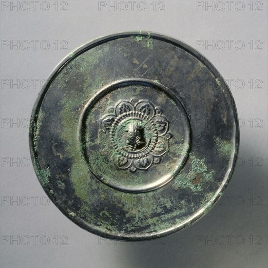 Mirror of Tortoise Knob and Lotus Pattern, early 7th Century - early 10th Century. China, Tang dynasty (618-907). Bronze; diameter: 12.5 cm (4 15/16 in.); overall: 0.7 cm (1/4 in.); rim: 0.5 cm (3/16 in.).