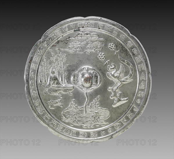 Lobed Mirror with a Tortoise Knob, a Musician, and a Phoenix, late 700s. China, Tang dynasty (618-907). Bronze; diameter: 21.6 cm (8 1/2 in.); overall: 1.2 cm (1/2 in.); rim: 0.6 cm (1/4 in.).