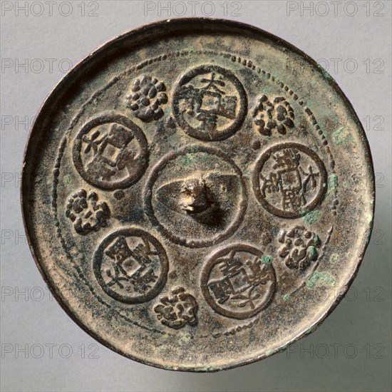 Mirror Featuring Dading Coins, c. 1178-1234. China, Jin dynasty (1115-1234). Bronze; diameter: 11.9 cm (4 11/16 in.); overall: 0.8 cm (5/16 in.); rim: 0.4 cm (3/16 in.).