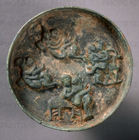 Small Erotic Mirror, late 13th Century-mid 14th Century. China, Yuan dynasty (1271-1368). Bronze; diameter: 7.2 cm (2 13/16 in.); overall: 1 cm (3/8 in.); rim: 1 cm (3/8 in.).
