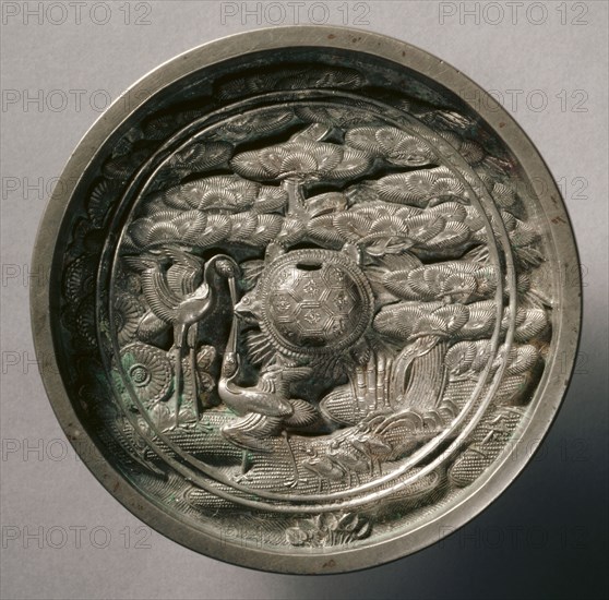 Mirror with Pine, Bamboo, and Cranes, early 17th-mid19th century. Japan, Edo (1615-1868). Bronze; diameter: 11.8 cm (4 5/8 in.); overall: 1.8 cm (11/16 in.); rim: 1.8 cm (11/16 in.).
