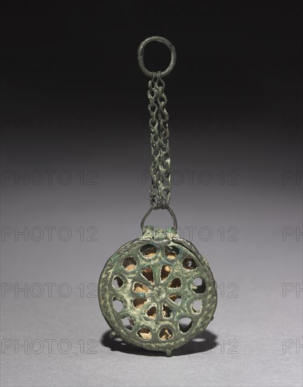 Phylactery (Reliquary Penant), c. 500-700. Byzantium, Egypt or Syria, early Byzantine period, 6th-8th centuries. Copper alloy; diameter: 3.2 cm (1 1/4 in.); overall: 7.8 cm (3 1/16 in.)