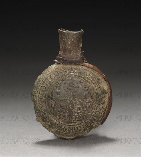 Pilgrim's Ampulla with Scenes of the Crucifixion (front) and the Ascension (back), c. 600. Byzantium, Palestine, early Byzantine period, early 7th Century. Tin-lead alloy with leather fragments; overall: 6.3 x 4.6 x 1.5 cm (2 1/2 x 1 13/16 x 9/16 in.).