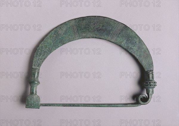 Fibula with Solar Design, c. 700-675 BC. Greece, Boeotian, 7th Century BC. Bronze; overall: 15.4 x 11.2 cm (6 1/16 x 4 7/16 in.).