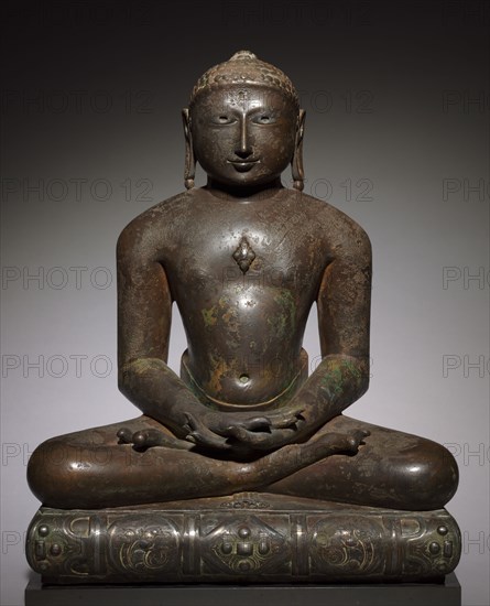 Jina (Tirthankara), 900s-1000s. India, Rajasthan, Medieval period. Bronze with silver inlay; overall: 61.5 x 49.5 x 36.8 cm (24 3/16 x 19 1/2 x 14 1/2 in.).