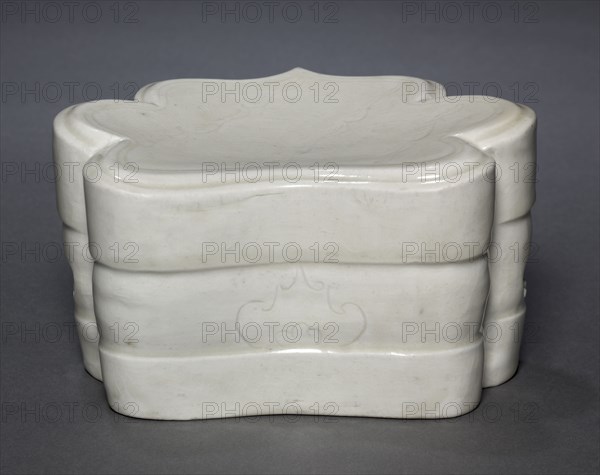 Cloud-Collar Pillow with Waves, 1000s-1100s. China, Jiangxi province, Northern Song dynasty (960-1127). Glazed porcelain with incised and carved decoration; overall: 10 x 17.5 x 13.4 cm (3 15/16 x 6 7/8 x 5 1/4 in.).