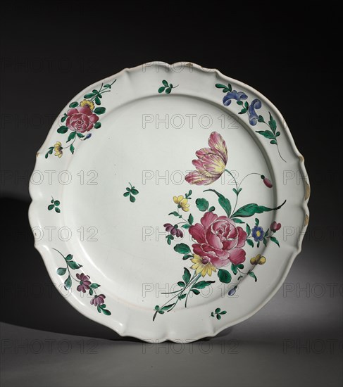 Plate, c. 1750-1770. France, 18th century. Faience; overall: 3.5 x 115.2 x 36 cm (1 3/8 x 45 3/8 x 14 3/16 in.).
