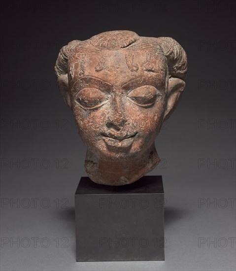 Female Head, 400s-500s. India, Gangetic plain region, Gupta period, 5th-6th centuries. Terracotta; overall: 30 x 18 x 17.2 cm (11 13/16 x 7 1/16 x 6 3/4 in.).