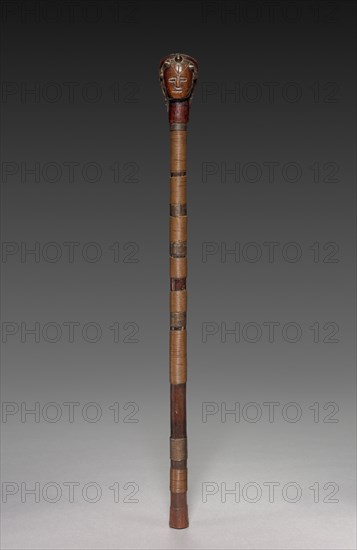 Scepter, late 1800s or early 1900s. Ovimbundu people, Angola, Central Africa, Africa, late 19th or early 20th century. Wood, metal, brass, fiber; overall: 57.5 x 4.5 x 5.5 cm (22 5/8 x 1 3/4 x 2 3/16 in.)