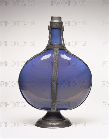 Flask; Façon de Venise, France, possibly, about 1550 - 1600; Free-blown dichroic, Prussian blue to smoky brown, glass