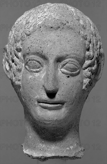 Head of a Votive Statue; Etruria; about 450 B.C; Terracotta with polychromy; 29.7 cm, 11 11,16 in