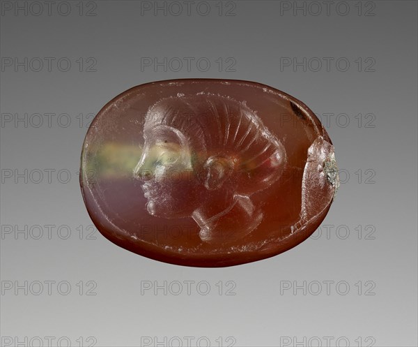 Engraved Scaraboid; 480 - 470 B.C; Carnelian with clear patches; 0.4 × 1 × 0.7 cm, 3,16 × 3,8 × 1,4 in