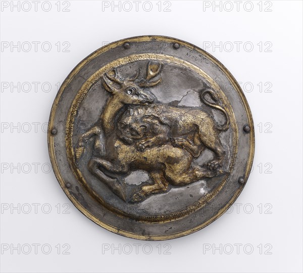 Phalera with Relief of Lion Attacking a Stag; Parthia; 2nd century B.C; Silver with gilding; 9 × 12.6 cm, 3 9,16 × 4 15,16 in