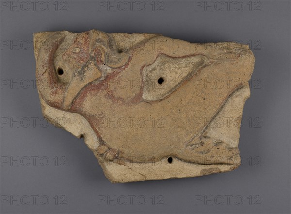 Mutulus plaque with Triton; Etruria; 510 - 475 B.C; Terracotta; 29.5 × 49.3 × 5.1 cm, 11 5,8 × 19 7,16 × 2 in
