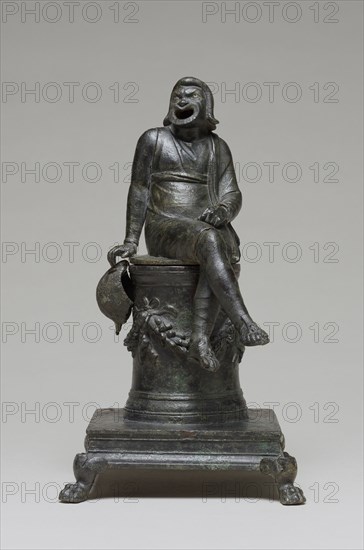 Incense Burner Shaped as a Comic Actor Seated on an Altar; Roman Empire; first half of 1st century; Bronze with silver inlay